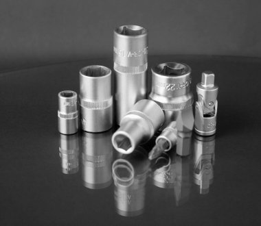 a set of hand tools on a black background