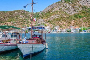 The bay of Agia Kyriaki with fishing boats. Agia Kyriaki is a small picturesque fishing village, the southernmost of the Pelion peninsula, in Magnesia, Thessaly, Greece. clipart