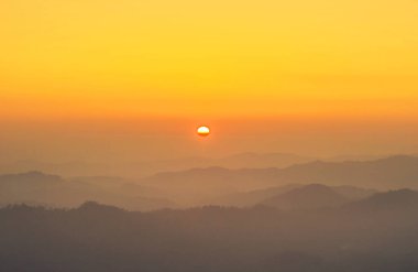 High angle sunset landscape view over mountains between border thai -  myanmar.  clipart