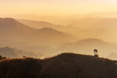 Landscape view sunset over mountains between border Thai -  Myanmar at Thong Pha Phum National park, Kanchanaburi, Thailand.  clipart