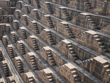 Detail steps of the Chand Baori Stepwell ancient deepest and largest stepwells of India in the village Abhaneri , Jaipur, Rajasthan ,India. clipart