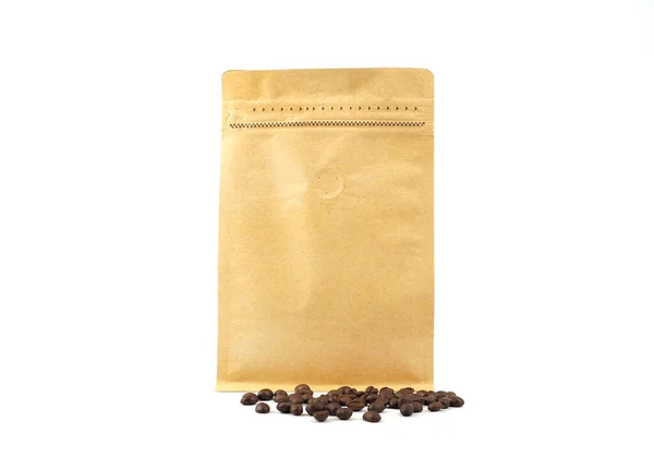 stock image Brown craft paper bag with vacuum-sealed, zipper and pile of seeds for packaging roasted coffee beans template isolated on a white background. Package mock-up for coffee or dry seeds product