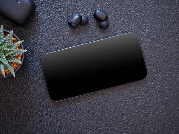 Top view, blank black screen of smartphone and wireless earphone in-ear with charging case on black leather background. Template, mock-up empty screen of mobile phone for text and logo of product