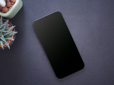 Üst manzara, siyah siyah siyah ekranlı akıllı telefon ve siyah deri arka planda kaktüs. Şablon, ürünün metin ve logosu için cep telefonu boş ekran maketi.
