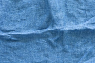 Dalgalı, dokulu, koyu mavi keten kumaş. soyut arkaplan tasarımı