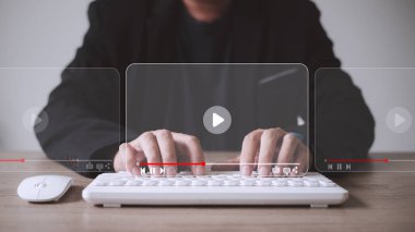 man using mouse and keyboard for streaming online, watching video on internet, live concert, show or tutorial