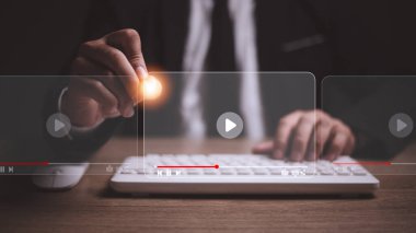 man using mouse and keyboard for streaming online, watching video on internet, live concert, show or tutorial