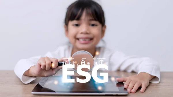 stock image Little girl watching a plant. Environmental technology concept. Sustainable development goals. SDGs.