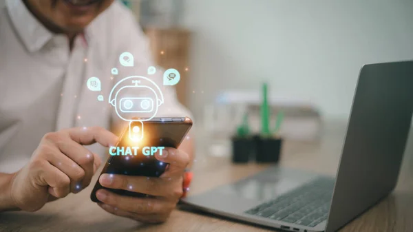 Digital chatbot, chat GPT, robot application, conversation assistant, AI Artificial Intelligence concept. Man using mobile smart phone, with digital chatbot on virtual screen