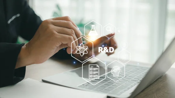 stock image R and D icon for Research and Development on laptop screen. Manage costs more efficiently. R and D innovation concept.