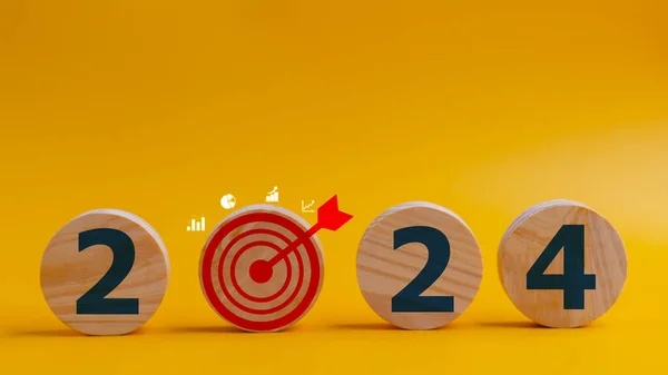 2024 goals of business or life. Wooden circles with 2024 and goal icons. Starting to new year. Business common goals for planning new projects, annual plans, business target achievement