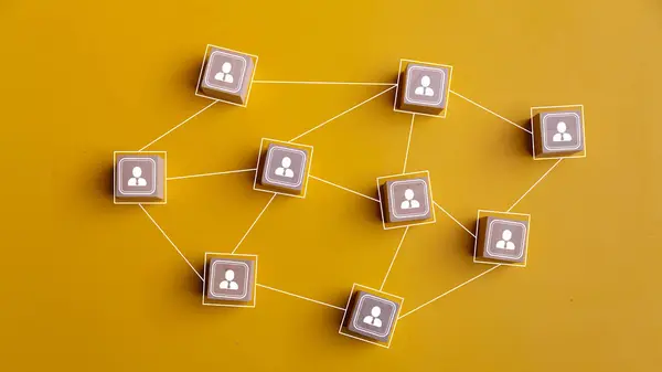 stock image Wooden blocks connected together on a yellow background. Teamwork, network, and community concept.