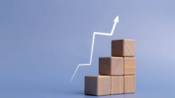 Rise arrow on wooden cube blocks, graph chart steps, profit, benefit, income, business growth process, technology trend, economic improvement concepts,