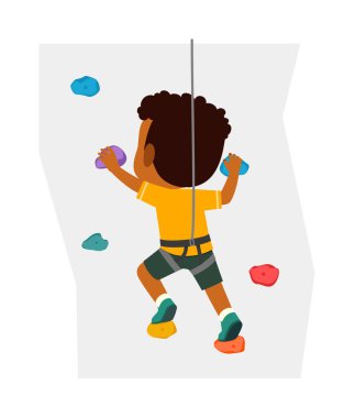 Küçük çocuk, adı duvar tırmanışı olan ekstrem spor yapıyor.