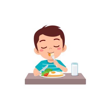 Küçük çocuk kahvaltıyı sağlıklı yiyeceklerle yapar.