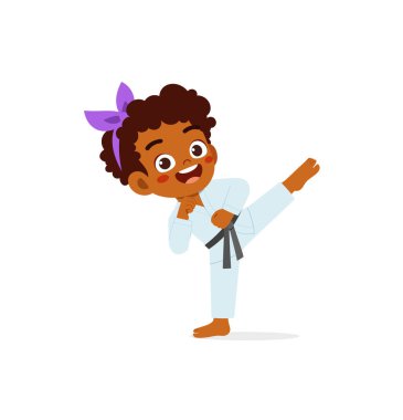 cute little kid training and showing karate pose