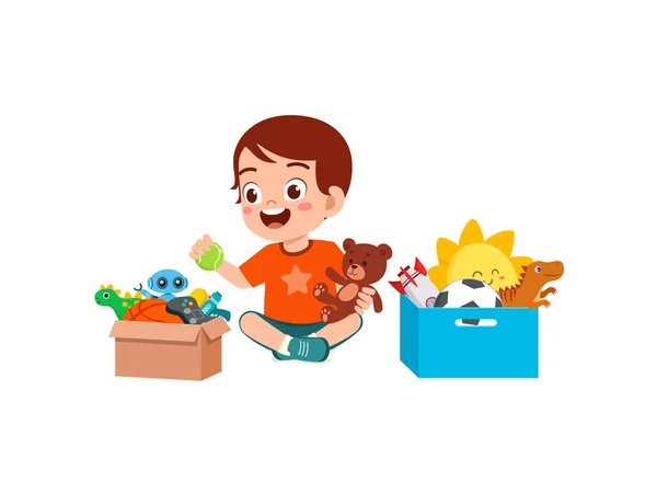 Liten Unge Sätta Leksaker Till Box För Donation — Stock vektor