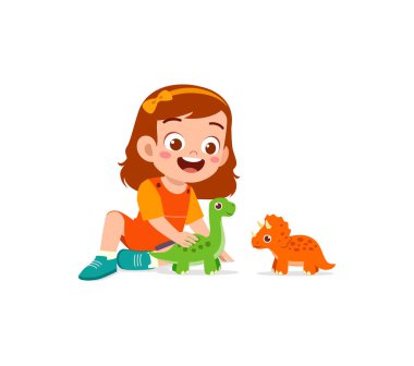 Küçük çocuk dinozor oyuncağıyla oynar ve mutlu olur.