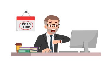 Erkek çalışan masa başında oturuyor ve son teslim tarihinden dolayı panikliyor.
