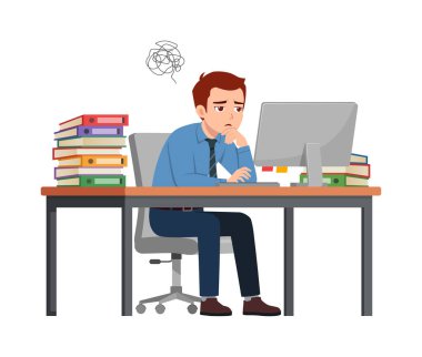 Adam çalışan masa başında oturuyor, ofiste çalışıyor ve kafası karışık.