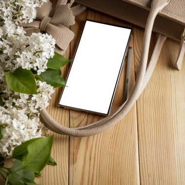 Leziz leylaklar, cep telefonları ve kadın çantası. Anneler Günü için mükemmel bir tasarım. Metin veya ürün için akıllı telefon ekran kopyalama alanı