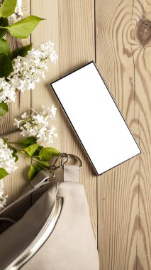 Leziz leylaklar, cep telefonları ve kadın çantası. Anneler Günü için mükemmel bir tasarım. Metin veya ürün için akıllı telefon ekran kopyalama alanı