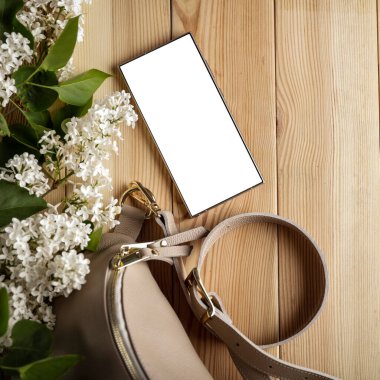 Leziz leylaklar, cep telefonları ve kadın çantası. Anneler Günü için mükemmel bir tasarım. Metin veya ürün için akıllı telefon ekran kopyalama alanı