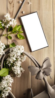 Leziz leylaklar, cep telefonları ve kadın çantası. Anneler Günü için mükemmel bir tasarım. Metin veya ürün için akıllı telefon ekran kopyalama alanı