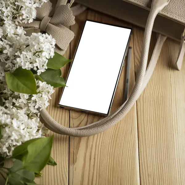 Leziz leylaklar, cep telefonları ve kadın çantası. Anneler Günü için mükemmel bir tasarım. Metin veya ürün için akıllı telefon ekran kopyalama alanı