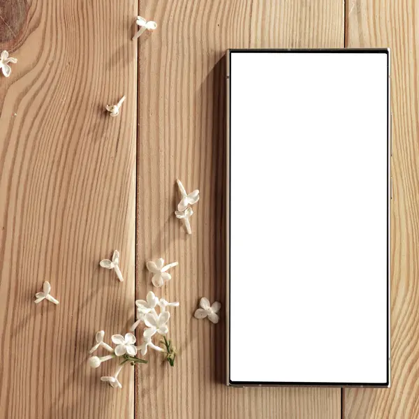 Metin veya ürün için kopyalama alanı olan ahşap bir masanın üzerinde düz bir akıllı telefon yatıyordu. Moda, kozmetik, yaşam tarzı proje tasarımları veya ürün yerleştirme temaları için mükemmel