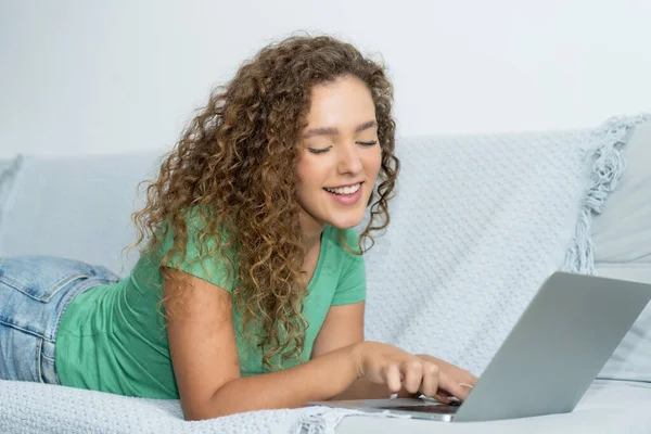 Stock image Happy young adult caucasian woman shopping online at computer indoors at home