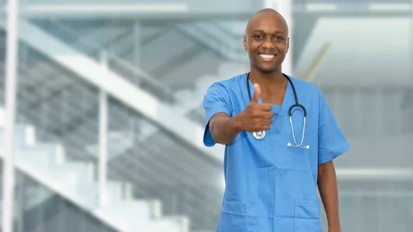 Optimistic black doctor or male nurse at hospital