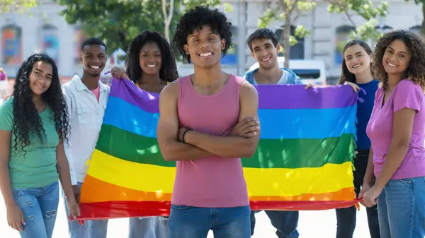 Laughing Brazilian Male Young Adult Lgbtq Rainbow Flag Group International lizenzfreie Stockbilder