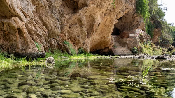 Ain Garziz Spring, a well-known fresh-water spring and picnic spot close to Salalah. There are several caves at the site as well.