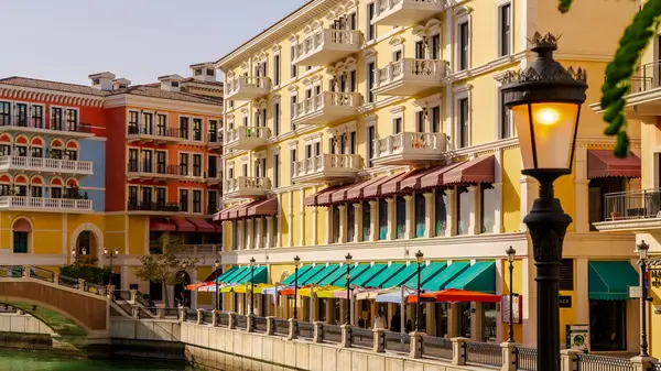stock image Qanat Quartier,Doha, Qatar- February 20,2024: residential and shops in vibrant colors at pearl residential area with venice concept.