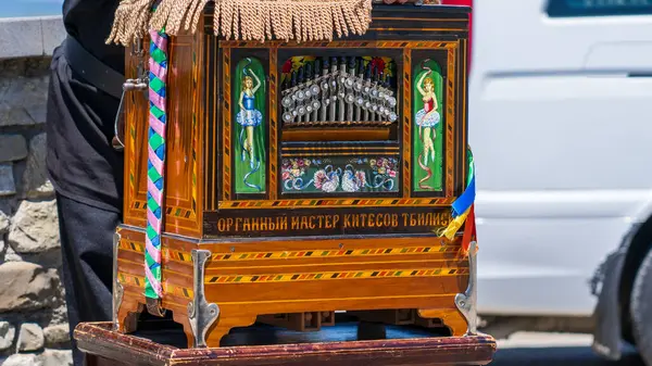 stock image Tbilisi, Georgia - June 6, 2024: A barrel organ at georgia, traditional musical instrument.