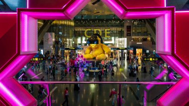 Doha, Qatar, August 20, 2024: The iconic Lamp Bear sculpture by Swiss artist Urs Fischer is prominently displayed in the grand foyer of Hamad International Airport, leading to the world-class duty-free shopping area. The artwork, a playful and vibran clipart