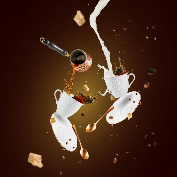 Cup with splashes of coffee and milk on color dark background. falling coffee mug with coffee and milk