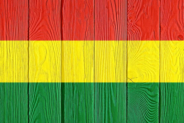 Bolivia flag painted on old wood plank background. Brushed natural light knotted wooden planks board texture. Wooden texture background flag of Bolivia