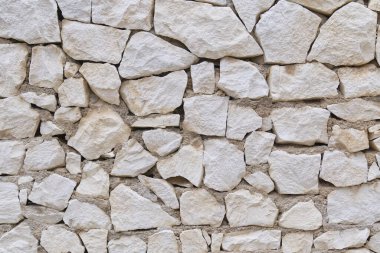 Stone fence wall texture, panoramic garden stonewall, limestone dolomite white slate slab rock texture. abstract background