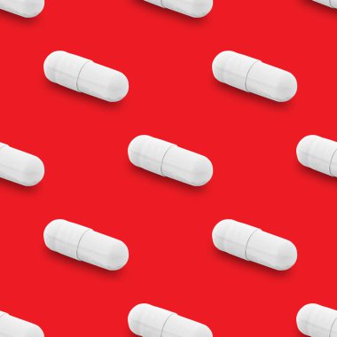 Gel capsule seamless pattern. White capsule shaped medicine. pharmacy concept. food supplement. Capsule pills pattern on a red background