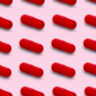 Gel capsule seamless pattern. Red capsule shaped medicine. pharmacy concept. food supplement. Capsule pills pattern on a pink background