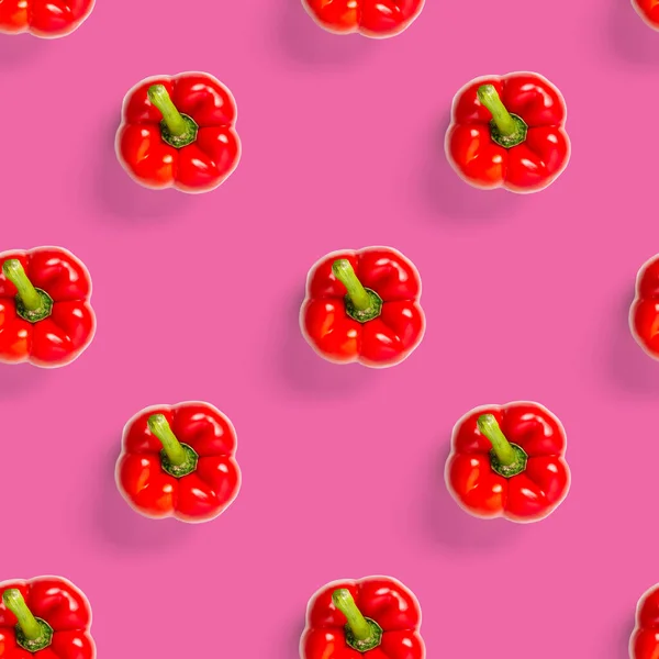 seamless pattern of bulgarian red pepper on pink background. paprika wallpaper, sweet pepper print pattern, top view, flat layout, isolated.