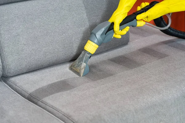 Sofa before and after wet - cleaning indoors. textile sofa vacuum cleaning. professional cleaning service concept.
