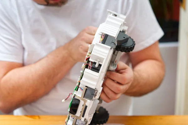 Repair of the robot vacuum cleaner. Disassembled robot vacuum cleaner. home electronics repair concept