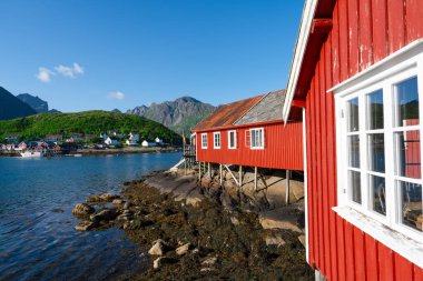 Norway. Fishermans red rorbu cottage in the Lofoten Islands. Typical Scandinavian Fishermans house. now days popular tourist apartments, cottages, rent houses.