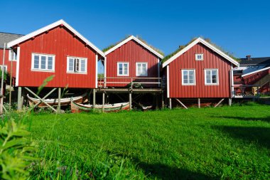 Norway. Fishermans red rorbu cottage in the Lofoten Islands. Typical Scandinavian Fishermans house. now days popular tourist apartments, cottages, rent houses.