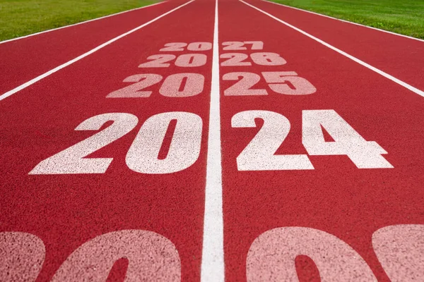 Year 2024 concept, success year. Athletics track with text 2024. Concept of challenge or career path and change. Sport in New year.