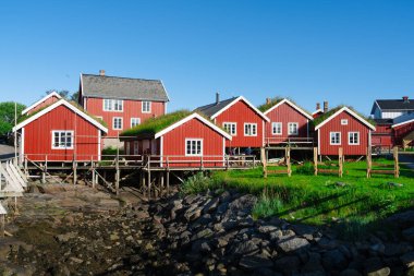 Norway. Fishermans red rorbu cottage in the Lofoten Islands. Typical Scandinavian Fishermans house. now days popular tourist apartments, cottages, rent houses.