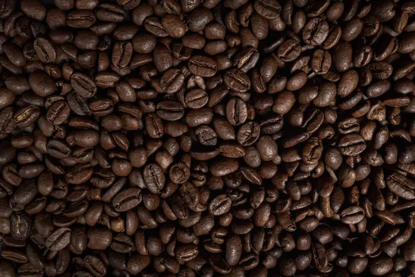 roasted coffee beans, can be used as a background. Coffee beans pattern. Top view, horizontal banner